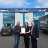 Cllr Mark Smith (r) with Top Gun Tools & Fixings team presenting Blackpool Net Zero Academy certificate