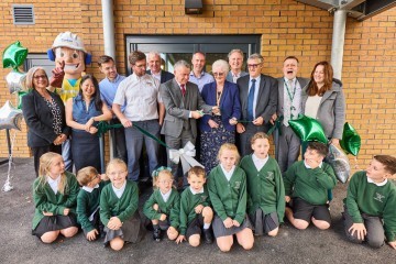 Matthew Tomlinson cuts the ribbon at Seven Stars Primary