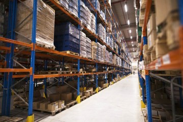 interior-large-distribution-warehouse-with-shelves-stacked-with-palettes-goods-ready-market.jpg.jpg