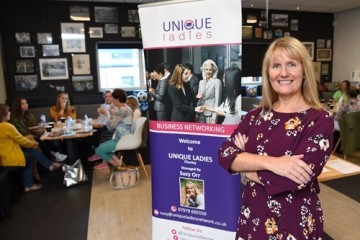 suzy-orr-founder-unique-ladies-networking-with-banner.jpg