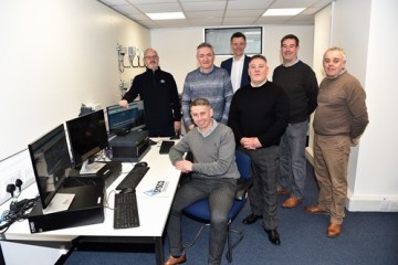 stephen-gregson-centre-back-with-members-of-the-sysco-team.jpg