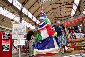 ACCRINGTON MARKET MANAGER SAMEENA KING AND CLLR MARLENE HOWARTH LEADER OF HYNDBURN BOROUGH COUNCIL WITH THE SPECTACULAR CULTURE DISPLAY.jpg.jpg