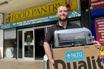 Eddy O Brien Chair of Hyndburn Food Pantry with their donation of a new toaster from NLTG.jpg.jpg