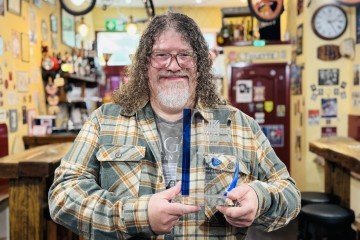 Festival Co Ordinator Simon Shackleton with the UK Blues Federation award.jpg.jpg