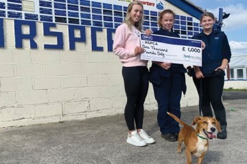 hml-marketing-assistant-maddie-rogan-left-handing-over-the-donation-to-emily-nutter-centre-hannah-clegg-right-and-little-bobby-bottom-from-rspca.jpg