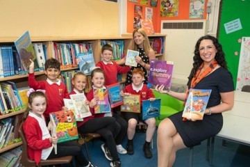 bellways-sales-advisor-natalie-right-delivering-new-books-to-pupils-at-st-aidans-in-bamber-bridge.jpg