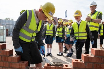 George C, aged 9, from Crow Orchard Primary School learns brick laying with Bellway.jpg.jpg