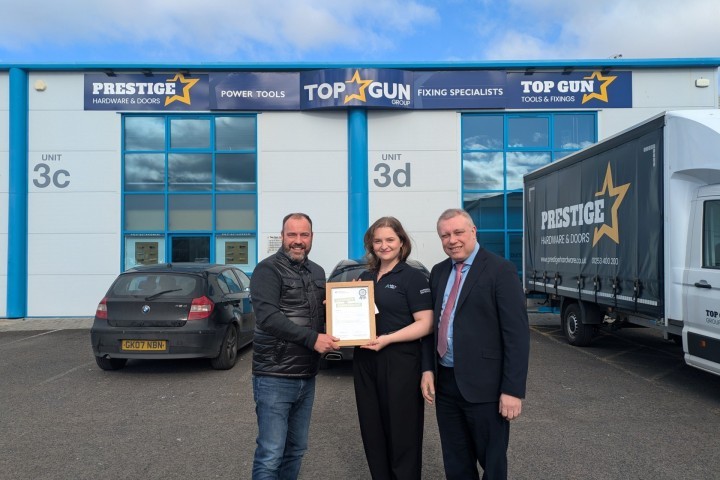 Cllr Mark Smith (r) with Top Gun Tools & Fixings team presenting Blackpool Net Zero Academy certificate