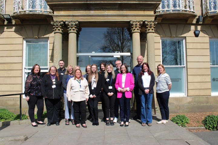 Sarah Smith MP for Hyndburn and Haslingden, staff from DWP, staff from CSNW, and partners of CSNW gather outside Elmfield Hall to celebrate the launch of the Accrington Youth Hub