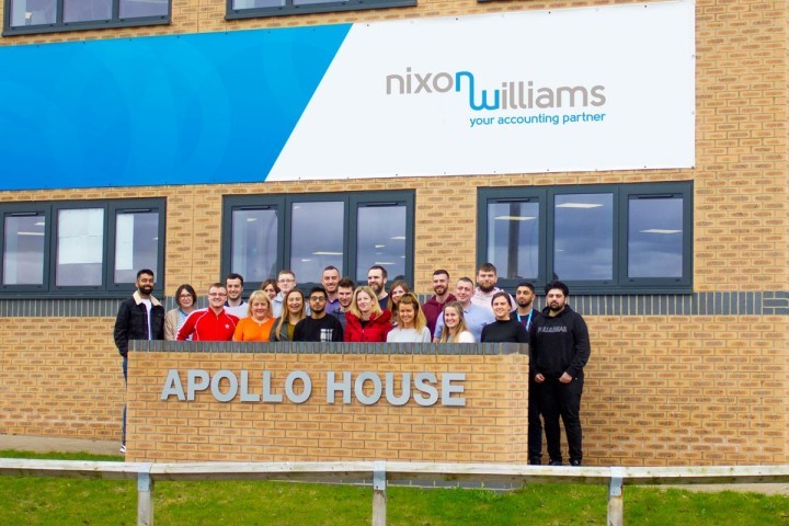 nixon-williams-employees-outside-their-new-office-on-whitehills-business-park.jpg