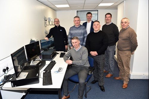stephen-gregson-centre-back-with-members-of-the-sysco-team.jpg