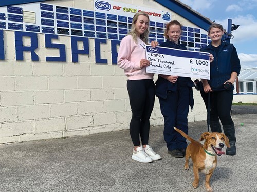 hml-marketing-assistant-maddie-rogan-left-handing-over-the-donation-to-emily-nutter-centre-hannah-clegg-right-and-little-bobby-bottom-from-rspca.jpg