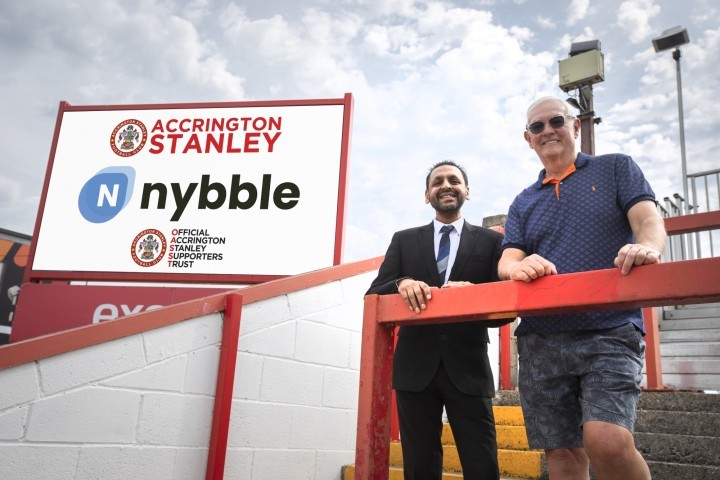 Nybble Managing Director Ram Gupta and OASST Chairman Peter Leatham next to the digital screen at the Wham Stadium.jpg.jpg