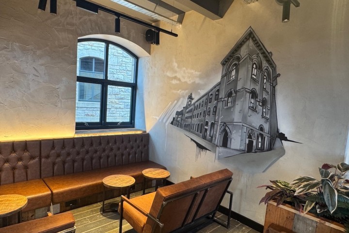 The modern art installed in Black Sheep Coffee Northlight features views of the buildings surrounding it.JPG.jpg