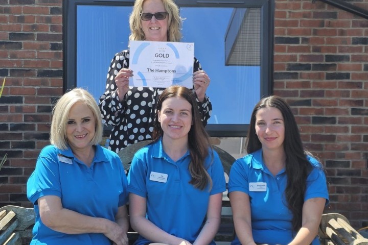 Ros, Tia and Steph with manager Sara behind holding certificate SMALLER.jpg.jpg