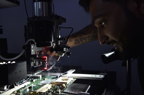 vikesh-rathod-at-work-on-a-bga-machine-removing-a-bespoke-siemens-chip-set.jpg