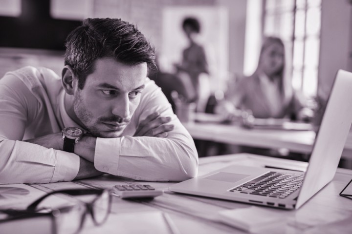 bored-1businessman-reading-e-mail-on-laptop-while-w-2024-12-13-21-05-28-utc.jpg.jpg